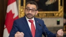 Minister of Transport Omar Alghabra speaks with members of the media after tabling legislation in the House of Commons, Nov. 17, 2022, in Ottawa. THE CANADIAN PRESS/Adrian Wyld