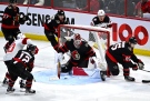 Ottawa Senators goaltender Cam Talbot (33) looks for the puck in his crease during third period NHL hockey action against the New Jersey Devils, in Ottawa, on Saturday, Nov. 19, 2022. THE CANADIAN PRESS/Justin Tang