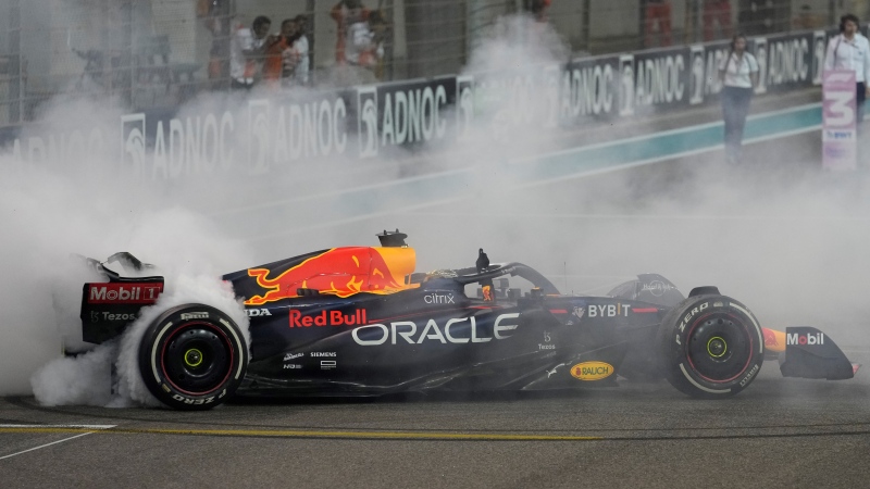 Red Bull driver Max Verstappen of the Netherlands burns tires after winning the Formula One Abu Dhabi Grand Prix, in Abu Dhabi, United Arab Emirates Sunday, Nov.20, 2022. (AP Photo/Kamran Jebreili, Pool)