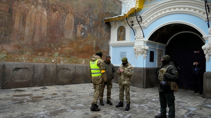 Ukraine's secret service guard the entrance to the Pechersk Lavra monastic complex in Kyiv, Ukraine, Tuesday, Nov. 22, 2022.  (AP Photo/Efrem Lukatsky)