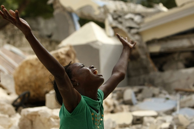 Cindy Terasme screams after seeing the feet of her dead 14-year-old brother Jean Gaelle Dersmorne in the rubble of the collapsed St. Gerard School in Port-au-Prince, Haiti, Thursday, Jan. 14, 2010. (AP / Gerald Herbert)