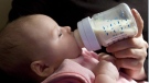 A six-week-old baby girl drinks from a baby bottle that apparently contains the compound bisphenol A in North Vancouver Friday, April 18, 2008. THE CANADIAN PRESS/Jonathan Hayward
