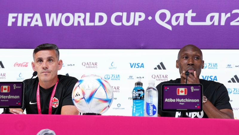 Canada head coach John Herdman and Canada captain Atiba Hutchinson speak to the media during a press conference ahead of their first match against Belgium at the World Cup in Doha, Qatar during on Tuesday, November 22, 2022. THE CANADIAN PRESS/Nathan Denette 