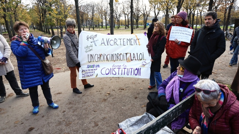 People gather outside the National Assembly in Paris, on Nov. 24, 2022. (Aurelien Morissard / AP) 