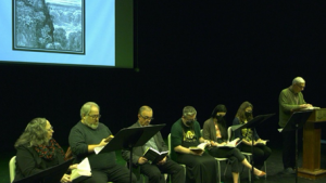 The U of R's reading of "Paradise Lost" was illuminated with a green light for better reading. (Anhelina Ihnativ / CTV News Regina) 
