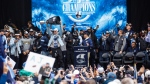 Chad Kelly, quarterback with the Toronto Argonauts raises the Grey Cup trophy as the Argonauts host a rally to celebrate their Grey Cup win, in downtown Toronto, Thursday, Nov. 23, 2022. THE CANADIAN PRESS/Cole Burston
