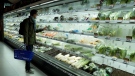 Looking at fresh produce in a supermarket in Beijing, China, on Nov. 25, 2022. (Ng Han Guan / AP)