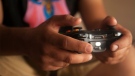 A person can be seen playing a video game in this undated file photo (Image source: Pexels)