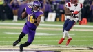 Minnesota Vikings wide receiver Justin Jefferson (18) runs from New England Patriots safety Devin McCourty (32) after catching a pass, on Nov. 24, 2022. (Andy Clayton-King / AP)