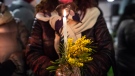 A woman holds a candle during the torchlight procession against Anna Borsa's femicide on March 1, in Pontecagnano Faiano, Italy. (Ivan Romano/Getty Images)