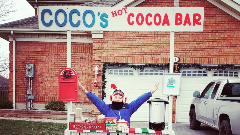 Cohen Lane and his cocoa stand are seen in this undated photograph provided by family.