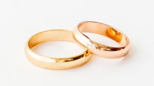 Two wedding rings are seen in a Shutterstock image. 
