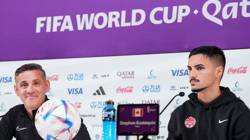 Canada head coach John Herdman, left, and Canada midfielder Stephen Eustaquio speak to the media at a press conference as they get set to play against Croatia during the World Cup in Doha, Qatar during on Saturday, November 26, 2022. THE CANADIAN PRESS/Nathan Denette