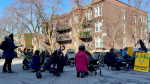 Protesters set up at the intersection where a child in a stroller was struck by a hit-and-run driver. The group would like more attention paid to road safety and less focus on car culture in the city. SOURCE: Velorution Montreal