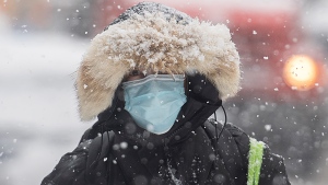 A person wears a face mask in Montreal, Wednesday, November 16, 2022.  THE CANADIAN PRESS/Graham Hughes 