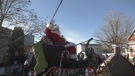 Santa Claus waves to the crowd lined up to see the Cobden Santa Claus Parade, Nov. 26, 2022. (Dylan Dyson/CTV News Ottawa)
