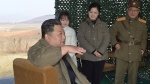 This photo provided on Nov. 19, 2022, by the North Korean government shows its leader Kim Jong Un, front, speaks, accompanied by his wife Ri Sol Ju, second from right, and his daughter, as Kim inspects the test firing of what it says a Hwasong-17 intercontinental ballistic missile, at Pyongyang International Airport in Pyongyang, North Korea, Friday, Nov. 18, 2022. (Korean Central News Agency/Korea News Service via AP)