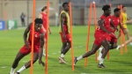 Canada forward Alphonso Davies, left, run a drill during practice at the World Cup in Doha, Qatar on Saturday, November 26, 2022. THE CANADIAN PRESS/Nathan Denette 