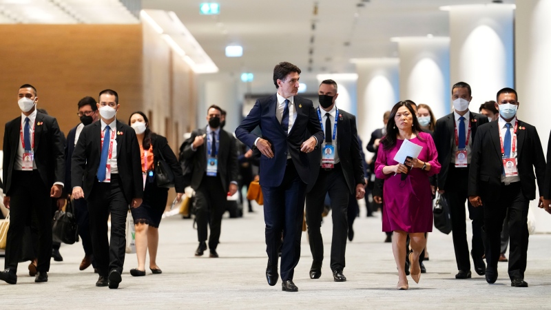 Prime Minister Justin Trudeau is joined by Minister of International Trade, Export Promotion, Small Business and Economic Development Mary Ng as he makes his way to hold a press conference following his participation in the APEC summit in Bangkok, Thailand on Nov. 18, 2022. (THE CANADIAN PRESS/Sean Kilpatrick)