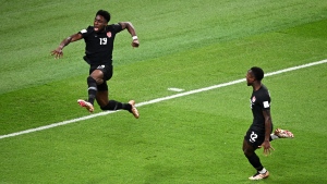 Alphonso Davies of Canada celebrates after scoring their team's first goal with their teammate Richie Laryea, right, during the FIFA World Cup Qatar 2022 Group F match between Croatia and Canada at Khalifa International Stadium on Nov. 27, 2022 in Doha, Qatar. (Photo by Stuart Franklin/Getty Images)