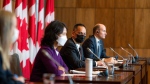 
Chief Public Health Officer of Canada Dr. Theresa Tam, left to right, Deputy Chief Public Health Officer Howard Njoo and Health Minister Jean-Yves Duclos speak during a press conference in Ottawa on Friday, Nov. 25, 2022. THE CANADIAN PRESS/Ashley Fraser