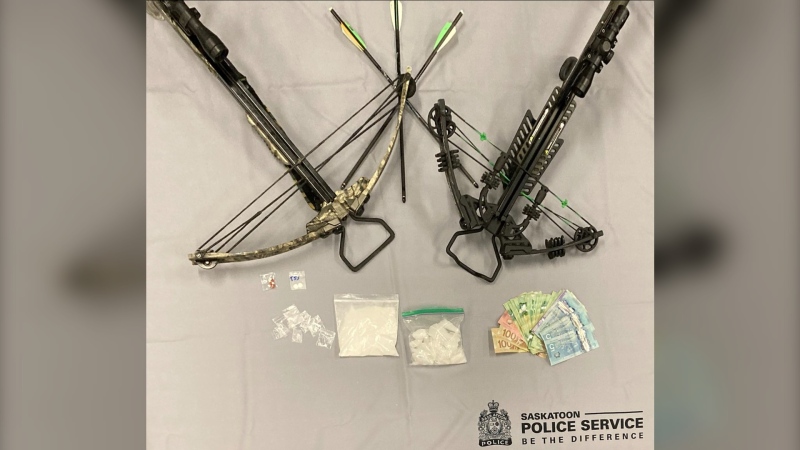 Two people face charges for trafficking and possession of a dangerous weapon following the execution of a warrant on Avenue C North on Thursday, Saskatoon police said.