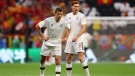 Germany's Thomas Muller, left, and Leon Goretzka before the 2022 World Cup group stage match against Spain on 27 Nov., 2022. (Photo by Christian Charisius/via Getty Images)