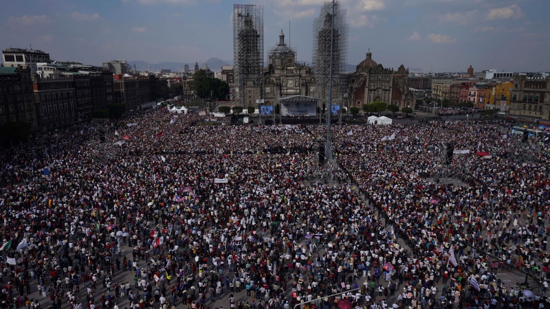 People gather in Mexico City’s main square as they listen to President Andrés Manuel Lopez Obrador Sunday, November 27, 2022. (AP Photo / Marco Ugarte)