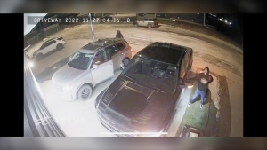 Surveillance image of some of the suspects in a Nov. 27 break-in of an RCMP officer's home in Cochrane, Alta. where a police badge and two vehicles were stolen. (image: RCMP)