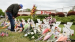 The suspect in Buffalo Tops mass shooting is expected to plead guilty to state charges Monday. Pictured is a memorial site outside the Tops supermarket in Buffalo, New York, on May 20.