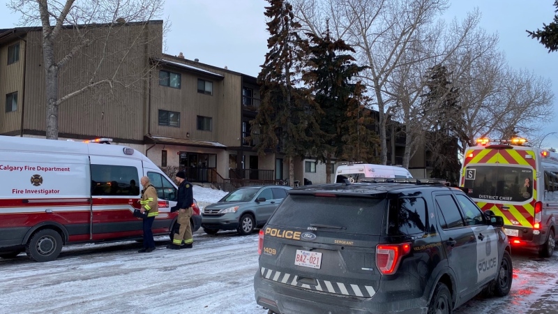 Emergency crews outside of an apartment building in the 2600 block of 16th Avenue S.E. following a fire where a body was found in a unit.