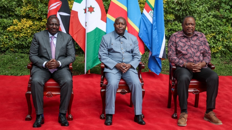 Kenya's President William Ruto, left, Burundi's President and summit chairperson Evariste Ndayishimiye, centre, and Kenya's former president and summit facilitator Uhuru Kenyatta, right, pose for a group photograph ahead of the Third Inter-Congolese Consultations of the Nairobi Peace Process, the political track, Nairobi III, at a hotel in Nairobi, Kenya, Nov. 28, 2022. The East African Community (EAC) led summit aims to find solutions to the ongoing armed conflict in eastern Congo. (AP Photo/Brian Inganga)