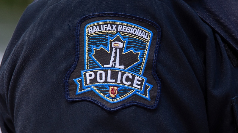 A Halifax Regional Police emblem is seen as police officers attend a murder scene in Halifax on July 2, 2020. THE CANADIAN PRESS/Andrew Vaughan 