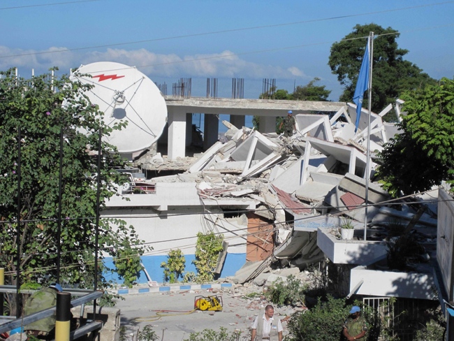 In this Wednesday, Jan. 13, 2010 photo released by the Philippine Mission to the United Nations, police officers from the United Nations inspect what was left of the United Nations Police Headquarters in Port-au-Prince.