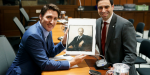 Prime Minister Justin Trudeau accepts a sketch portrait of his father Pierre Elliott Trudeau by London, Ont. artist Eric Drummond. The portrait was presented by London-Fanshawe MP Peter Fragiskatos. (Peter Fragiskatos/Twitter) 
