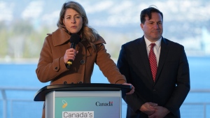 Minister of Foreign Affairs Melanie Joly, front left, responds to questions as Minister of Public Safety Marco Mendocino listens during a news conference to announce Canada's Indo-Pacific strategy in Vancouver on Sunday, November 27, 2022. THE CANADIAN PRESS/Darryl Dyck