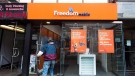 A man enters Freedom Mobile store in Toronto on Thursday, November 24, 2016. THE CANADIAN PRESS/Nathan Denette