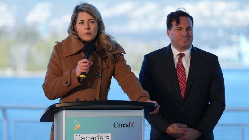 Minister of Foreign Affairs Melanie Joly, front left, responds to questions as Minister of Public Safety Marco Mendicino listens during a news conference to announce Canada's Indo-Pacific strategy in Vancouver on Sunday, Nov. 27, 2022. (THE CANADIAN PRESS/Darryl Dyck)