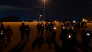 Community members gather for a candlelight vigil at Chesapeake City Park in Chesapeake, Va., Monday, Nov. 28, 2022, for the six people killed at a Walmart in Chesapeake, Va. (AP Photo/Carolyn Kaster)