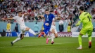 Christian Pulisic, middle, of USA scores his team's first goal past Majid Hosseini, left, Alireza Beiranvand, right, and Amir Abedzadeh of Iran during the FIFA World Cup Qatar 2022 Group B match between IR Iran and USA at Al Thumama Stadium on Nov. 29, 2022 in Doha, Qatar. (Photo by Marvin Ibo Guengoer - GES Sportfoto/Getty Images)