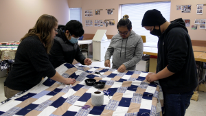 E.D. Feehan students volunteered to make quilts for relief kits at the Mennonite Central Committee on Nov. 29, just one small part of its Focus on the Family program.