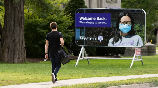 A student walks towards the Western University campus in London, Ont. on Wednesday, September 15, 2021. THE CANADIAN PRESS/Nicole Osborne
