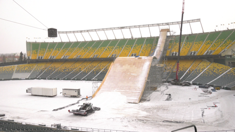 Snow is being trucked in from Rabbit Hill to help finish the giant jump being built for the FIS Snowboard Big Air World Cup in Commonwealth Stadium Dec. 9 and 10. (Joe Scarpelli/CTV News Edmonton)