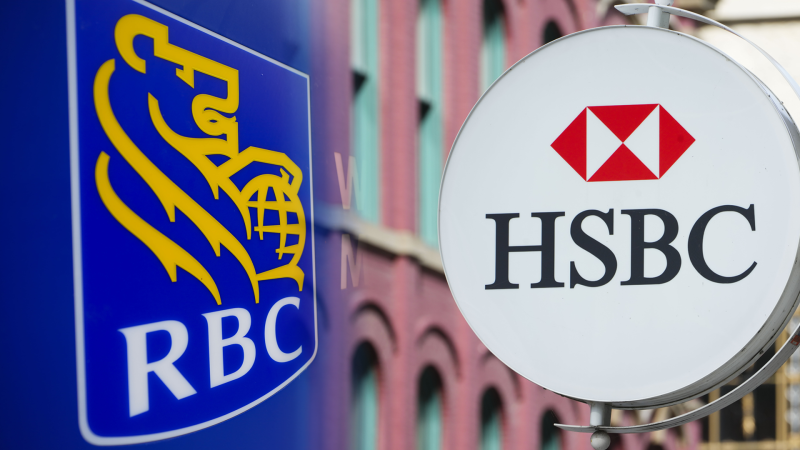 Composite image of Royal Bank of Canada Wealth Management (RBC) signage being pictured in Ottawa on Wednesday Sept. 7, 2022 (THE CANADIAN PRESS/Sean Kilpatrick) and an HSBC sign being pictured in Ottawa on Wednesday Sept. 7, 2022. THE CANADIAN PRESS/Sean Kilpatrick 