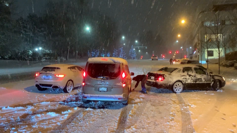 Cars are seen stuck in snow on Nov. 29 following a major snowstorm in B.C.'s Lower Mainland. 