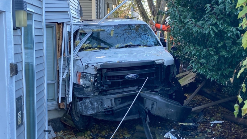 Traffic was being rerouted in Victoria's Fernwood neighbourhood Wednesday morning after a pickup truck slammed into a three-storey apartment building. (CTV News)