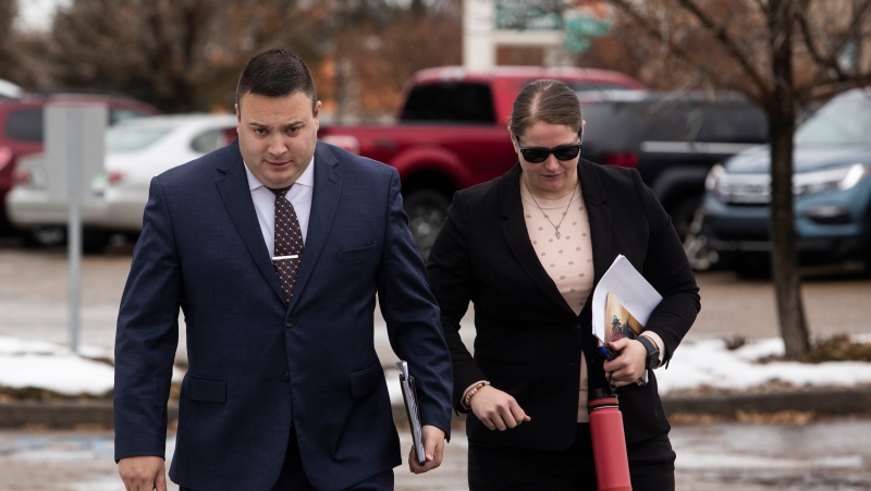 Cpl. Randy Stenger, left, and Const. Jessica Brown, return to court to resume their jury trial on charges of manslaughter and aggravated assault in Edmonton on Friday, Nov. 25, 2022. THE CANADIAN PRESS/Amber Bracken