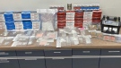 St. Albert RCMP show off items from a drug bust. (Credit: RCMP)