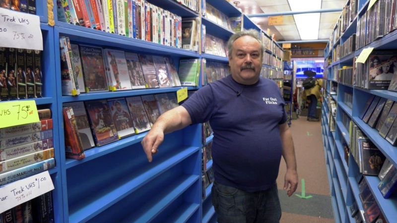 Far Out Flicks owner Rolf Glemser stands in the store ahead of its closing date on Jan. 15, 2023. (Spencer Turcotte/CTV News)