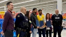 RCMP members present certificates of appreciation to employees at a Walmart in Moncton, N.B., on Nov. 30, 2022. (Alan Pickrell/CTV)